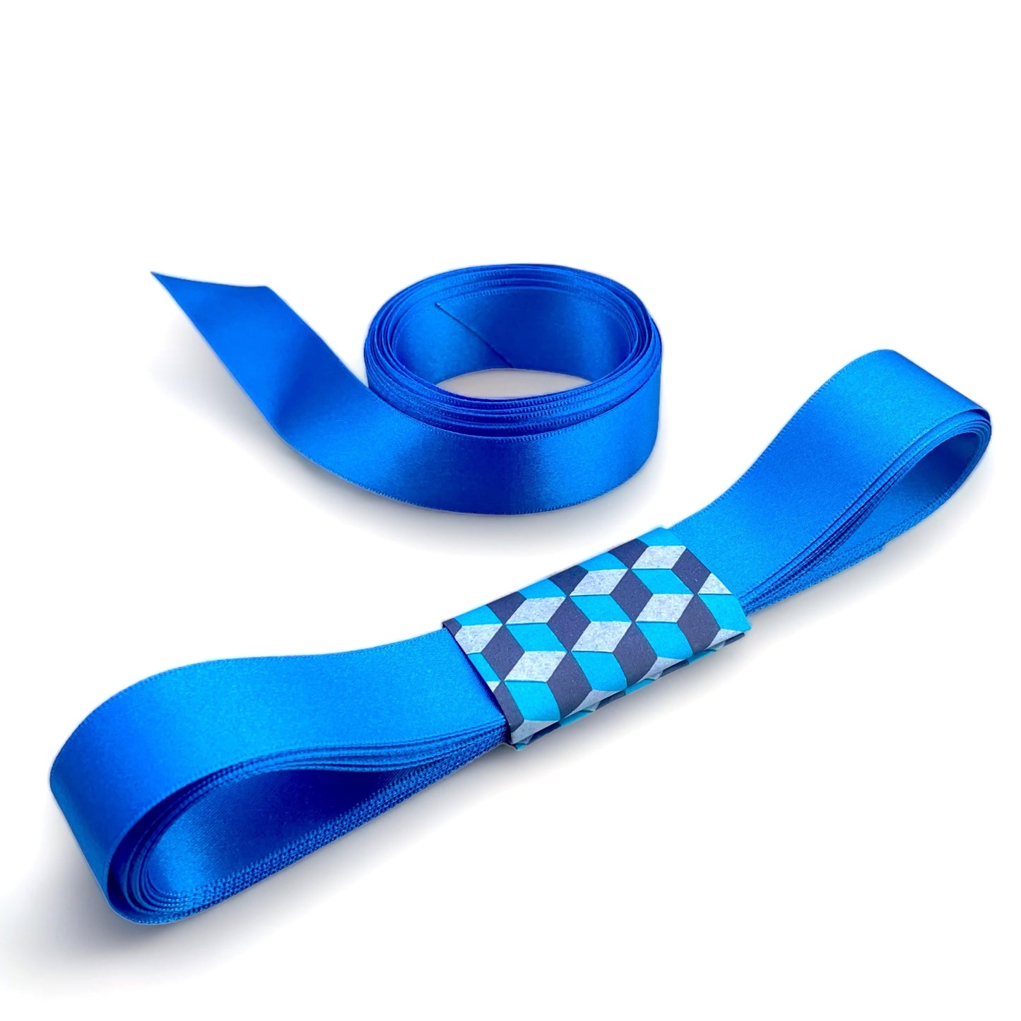 Satin ribbon 25mm wide and 5 metres long, presented with a patterned paper band. colour - royal blue