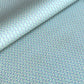 wrapping paper with a geometric zigzag design in aqua, blue and white