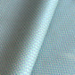 wrapping paper with a geometric zigzag design in aqua, blue and white