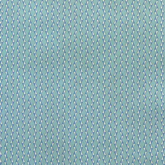 wrapping paper with a geometric zigzag design in aqua, blue and white