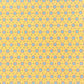 a sheet of wrapping paper with a yellow background and colorful blue circles pattern