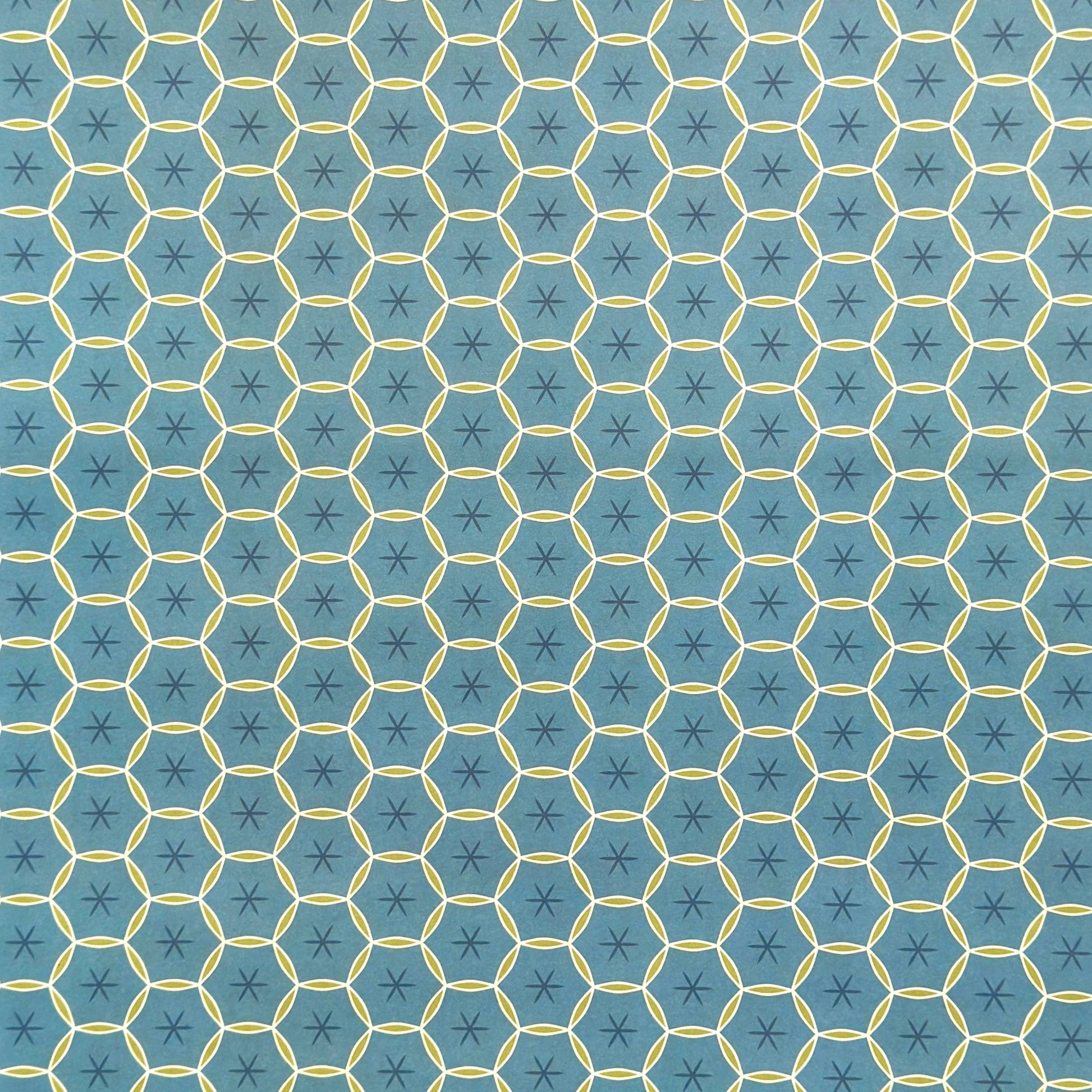 abstract wrapping paper with a geometric circle pattern with a star in the middle in teal blue and lime green