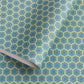 abstract wrapping paper with a geometric circle pattern with a star in the middle in teal blue and lime green