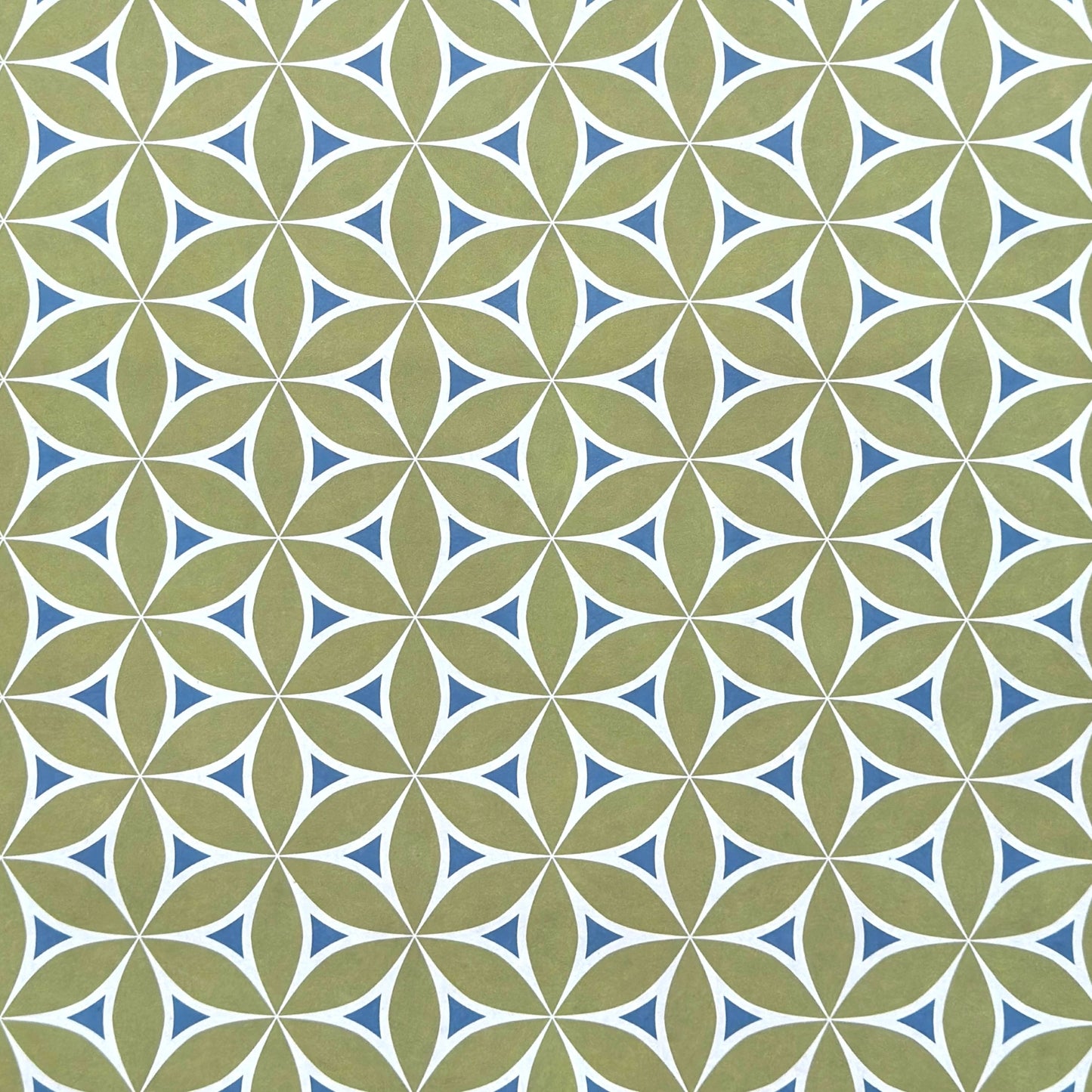 abstract wrapping paper with a geometric flower  pattern in lime green, teal blue and white