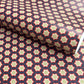 Patterned paper with red, green, and white stars on a blue background