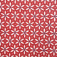 a sheet of wrapping paper with a floral geometric design in white and navy on red