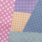 Patchwork of various geometric patterned wrapping papers in different colors