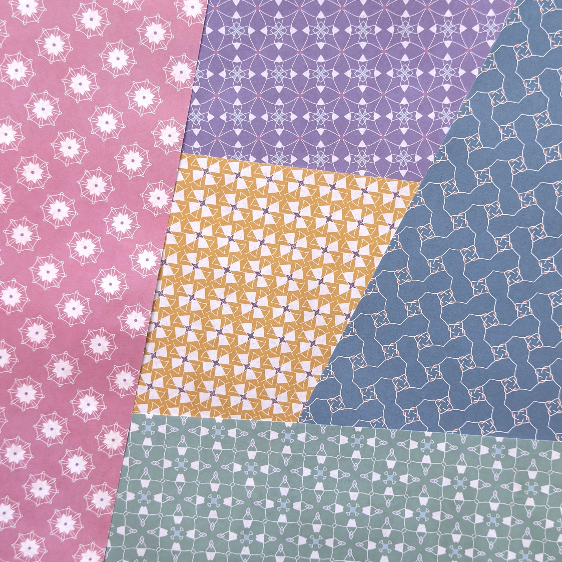 Patchwork of various geometric patterned wrapping papers in different colors