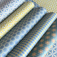 five different geometric wrapping papers in lime green and teal blue