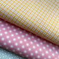 Three sheets of patterned paper in yellow, pink, and green.