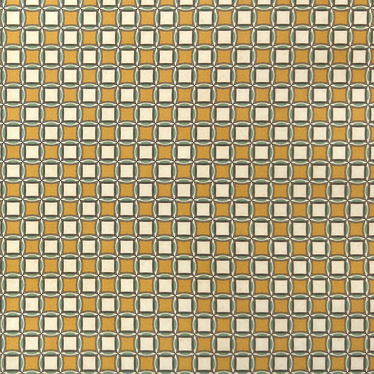 Patterned wrapping paper with geometric design in yellow, white, and green.