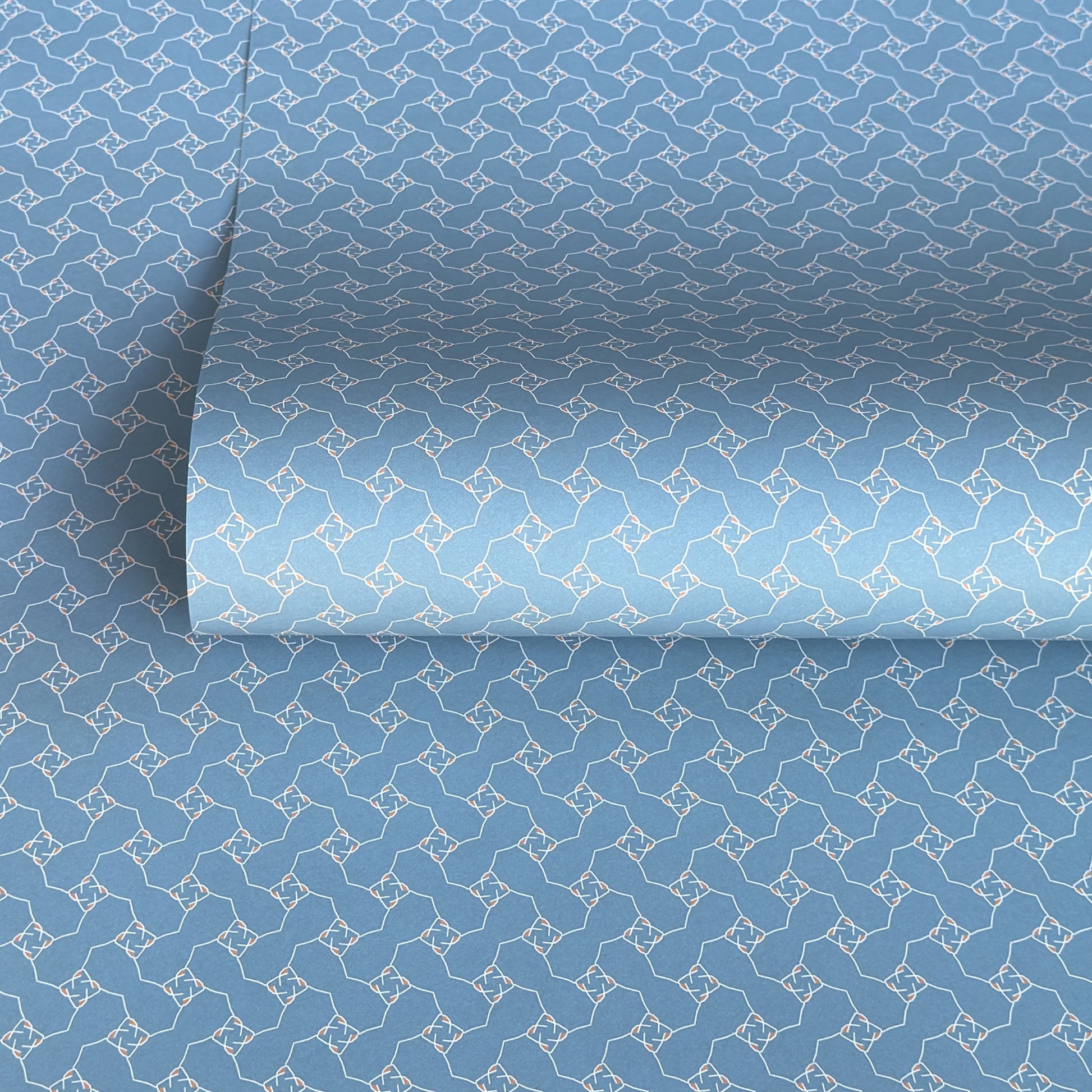 Blue patterned paper with a geometric design