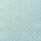a sheet of wrapping paper with a geometric design on aqua backdrop