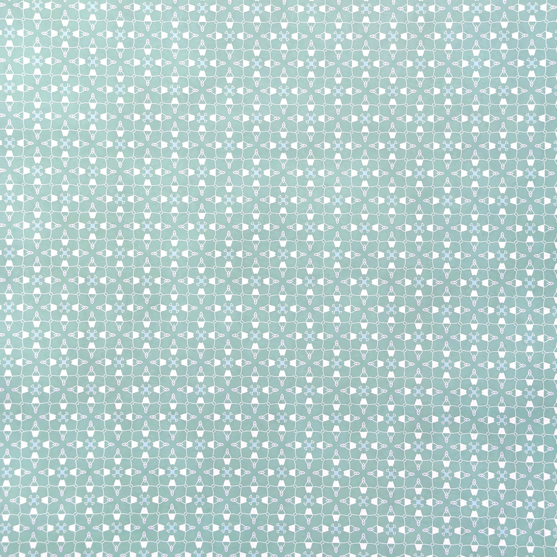 a sheet of wrapping paper with a geometric design on aqua backdrop