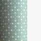 a sheet of wrapping paper with a geometric design on aqua backdrop