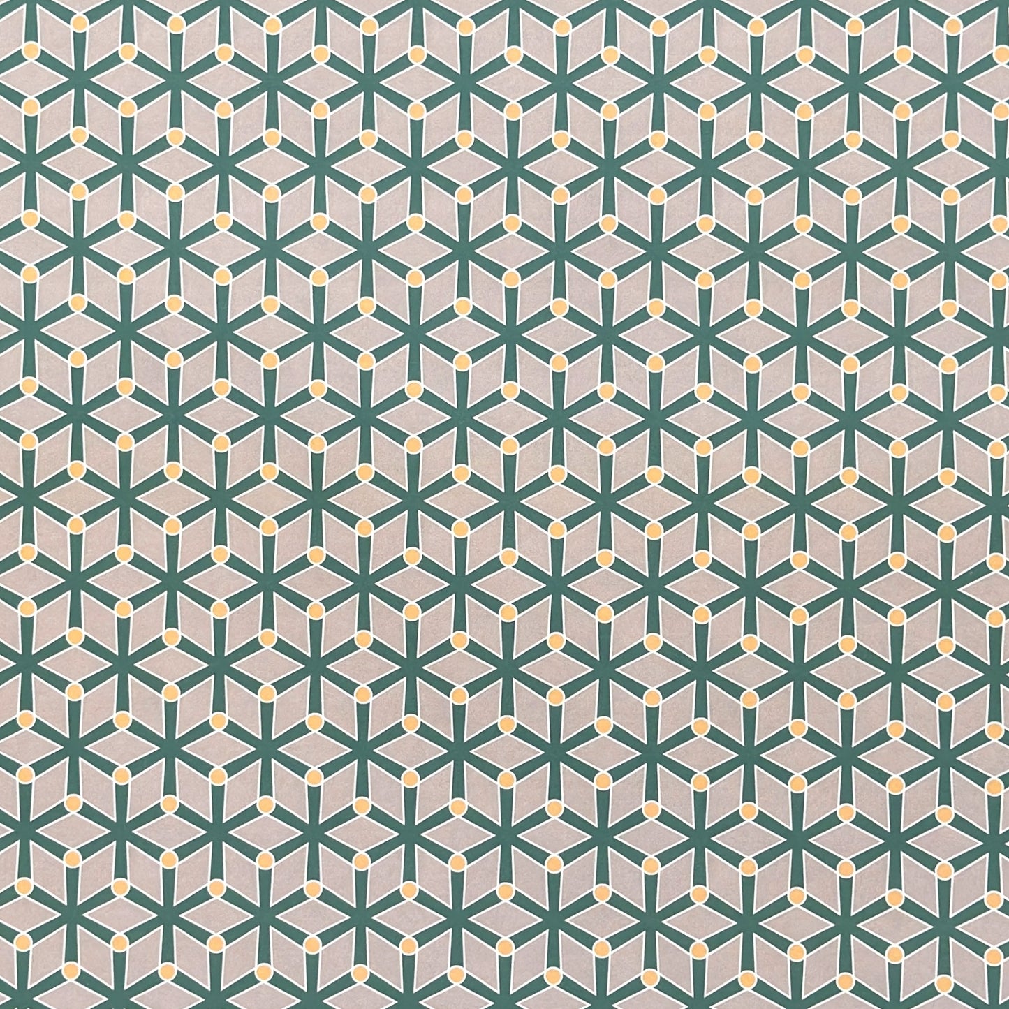wrapping paper with a geometric pattern in green and yellow on beige