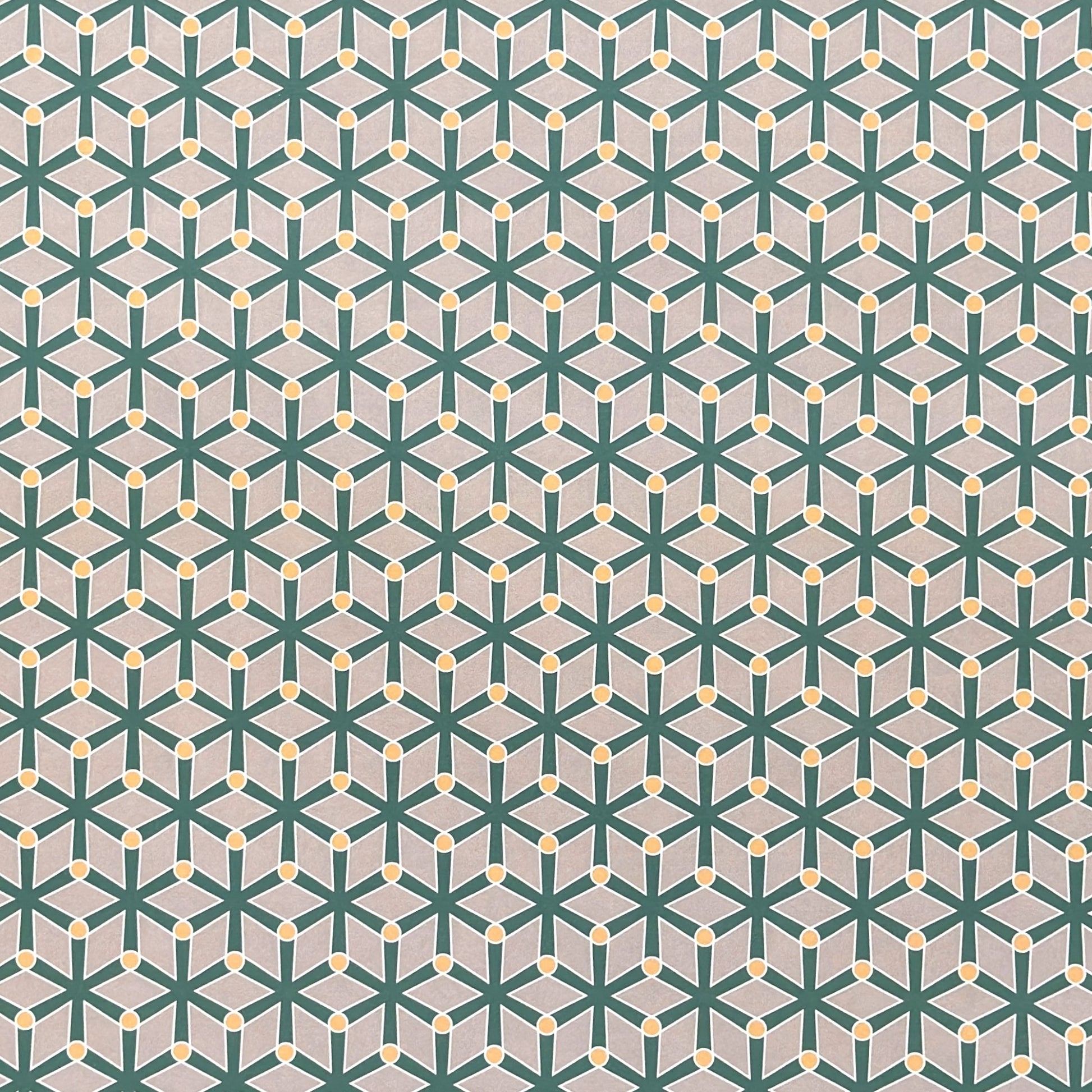 wrapping paper with a geometric pattern in green and yellow on beige