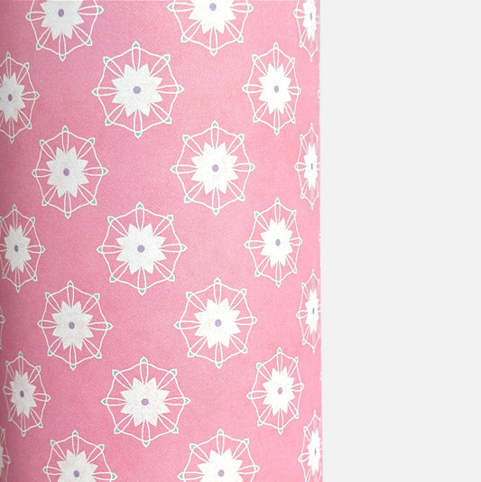 Pink wrapping paper with white floral geometric pattern