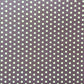 purple wrapping paper with a geometric pattern in white and black