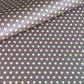 purple wrapping paper with a geometric pattern in white and black