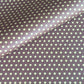 purple wrapping paper with a geometric pattern in white and black