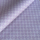 Patterned wrapping paper with geometric design on a purple background