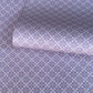 Patterned wrapping paper with geometric design on a purple background