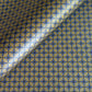 Wrapping paper with blue geometric pattern on a beige background