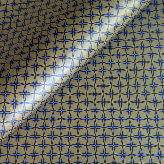 Wrapping paper with blue geometric pattern on a beige background