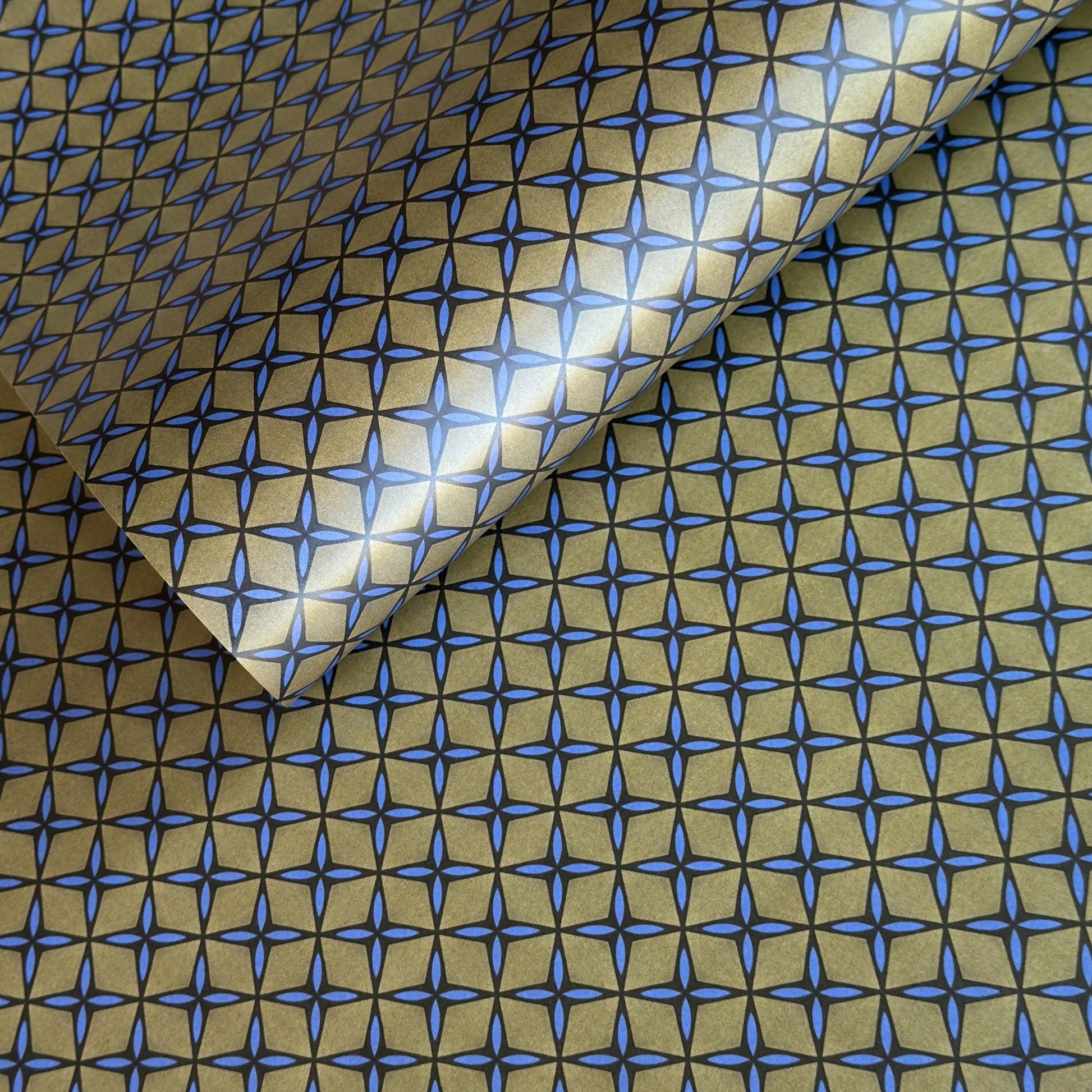 Wrapping paper with blue geometric pattern on a beige background