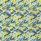 a sheet of wrapping paper with a pattern of yellow mimosa flowers and green leaves on a blue background
