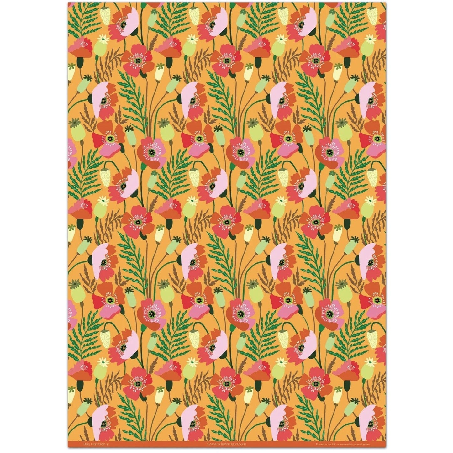 a sheet of wrapping paper with a pattern of stylised pink poppies with green foliage on an orange background
