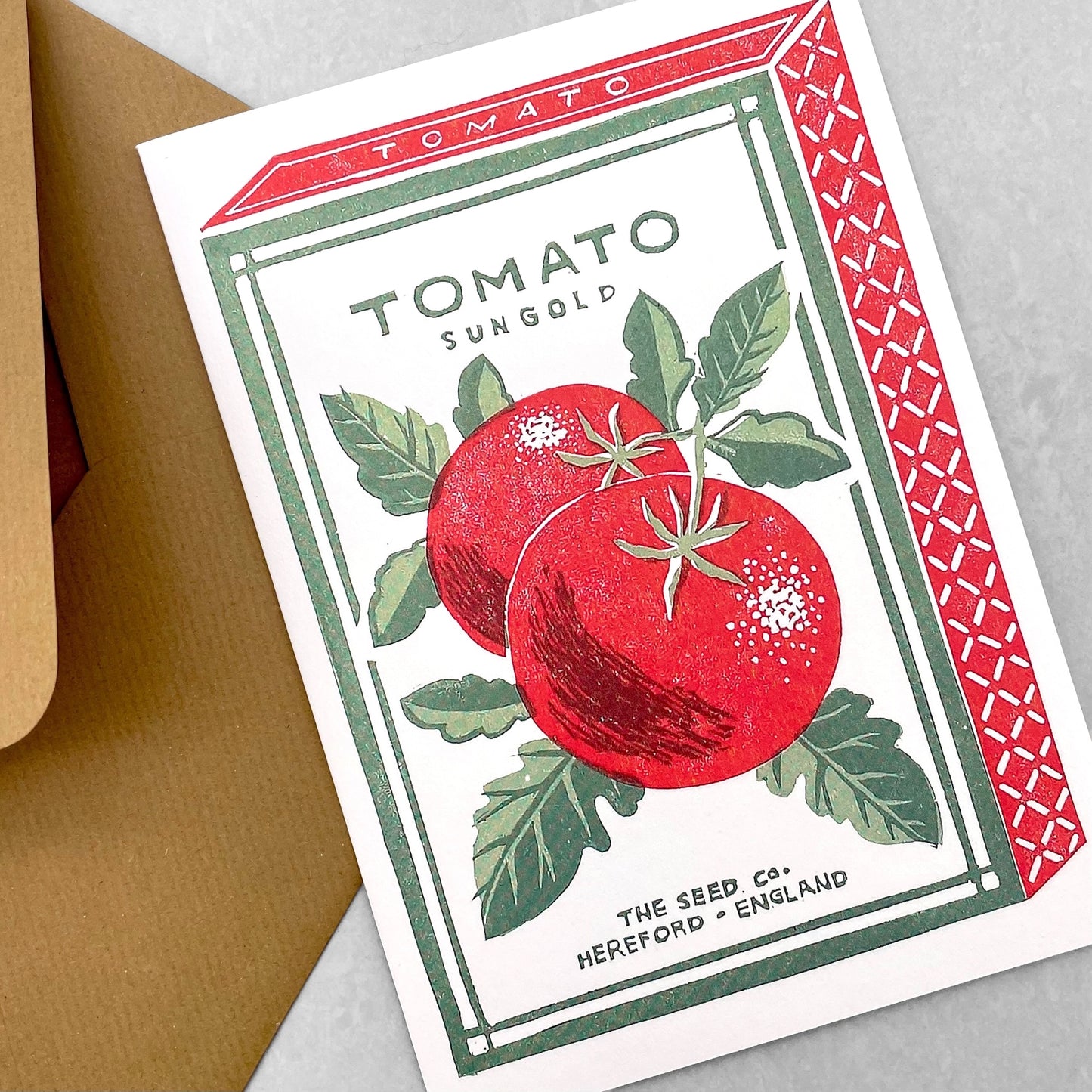 greetings card of a green and red vintage packet of tomato seeds by Canns Down Press