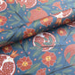 Pattern of pomegranates and flowers on a blue background- sheet of wrapping paper