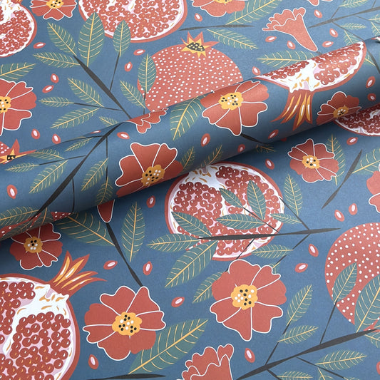 Pattern of pomegranates and flowers on a blue background- sheet of wrapping paper