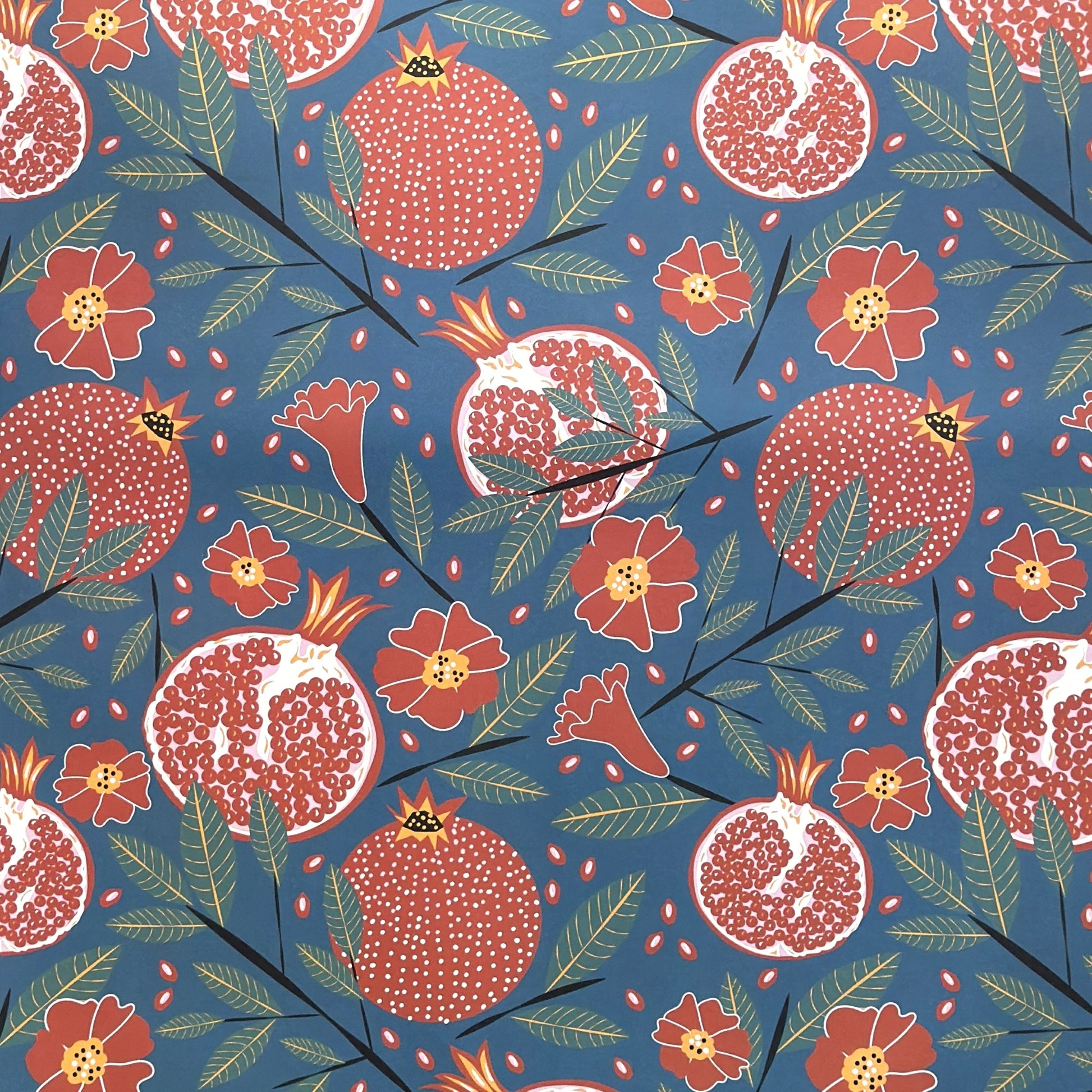 Pattern of pomegranates and flowers on a blue background- sheet of wrapping paper