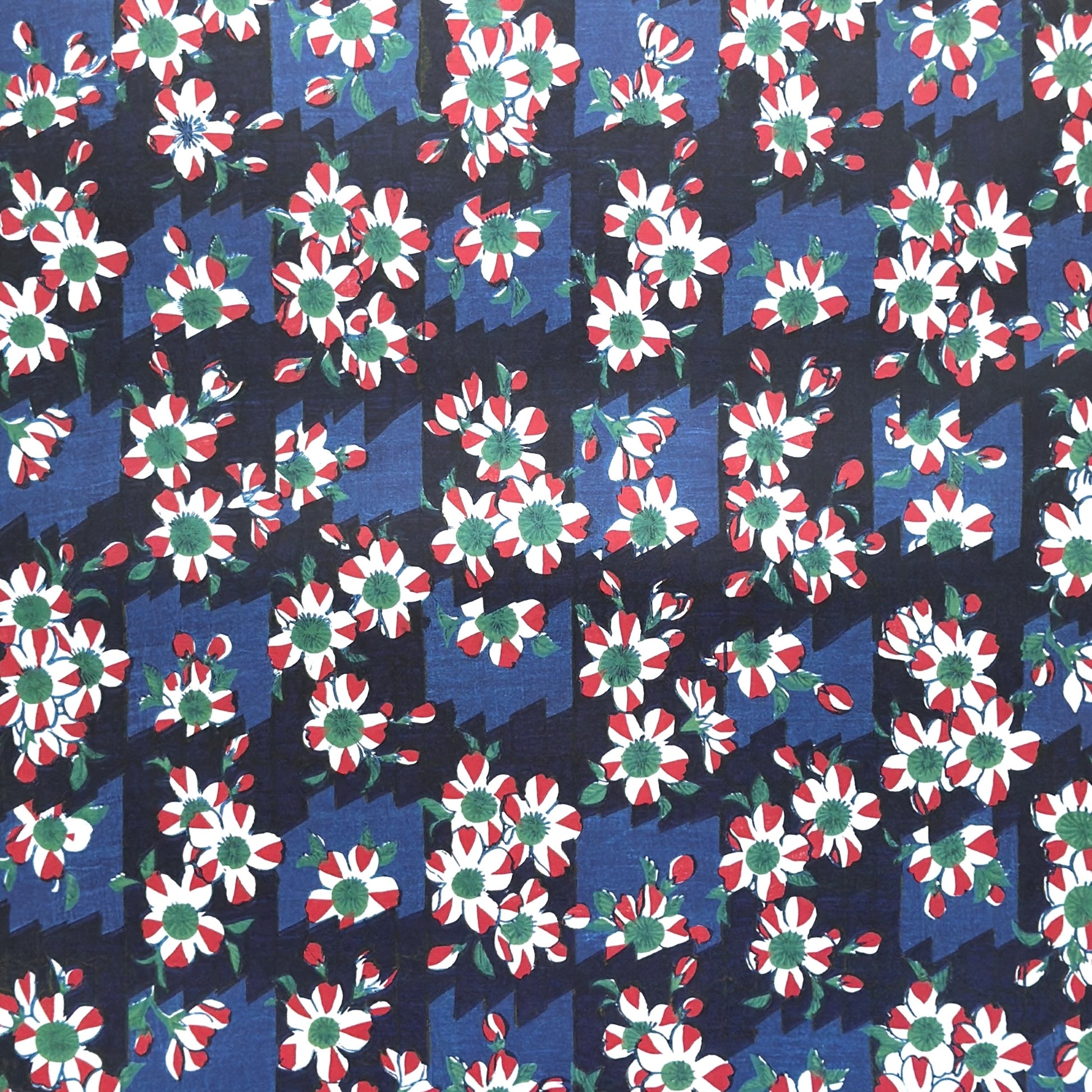 wrapping paper with a red and white flower pattern on two-toned blue background