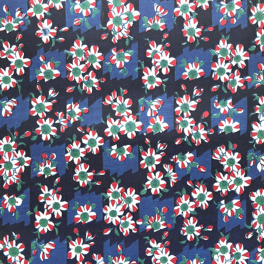 wrapping paper with a red and white flower pattern on two-toned blue background