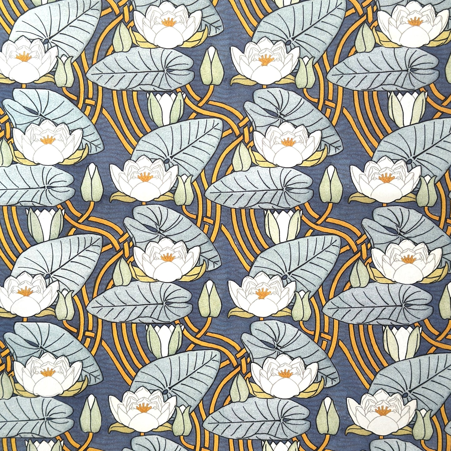 a sheet of wrapping paper with a stylised image of waterlilies in tones of blue, white and yellow  