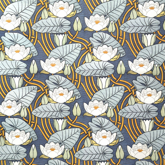 a sheet of wrapping paper with a stylised image of waterlilies in tones of blue, white and yellow  