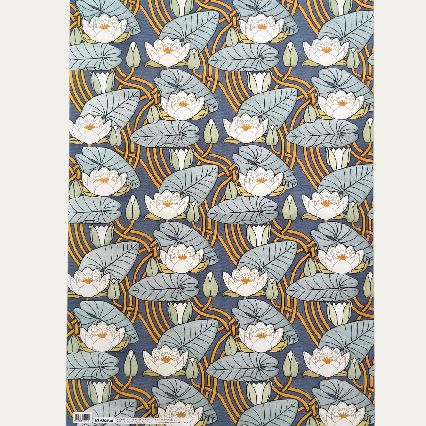 a sheet of wrapping paper with a stylised image of waterlilies in tones of blue, white and yellow. Full sheet  