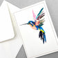 greetings card of a colourful humming bird in flight by Com Bossa Studio