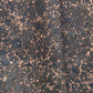 A printed marble design wrapping paper in tones of brown, blue and soft coral pink.