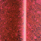 printed wrapping paper with a marbled stone pattern in deep reds and pinks by Compton Marbling