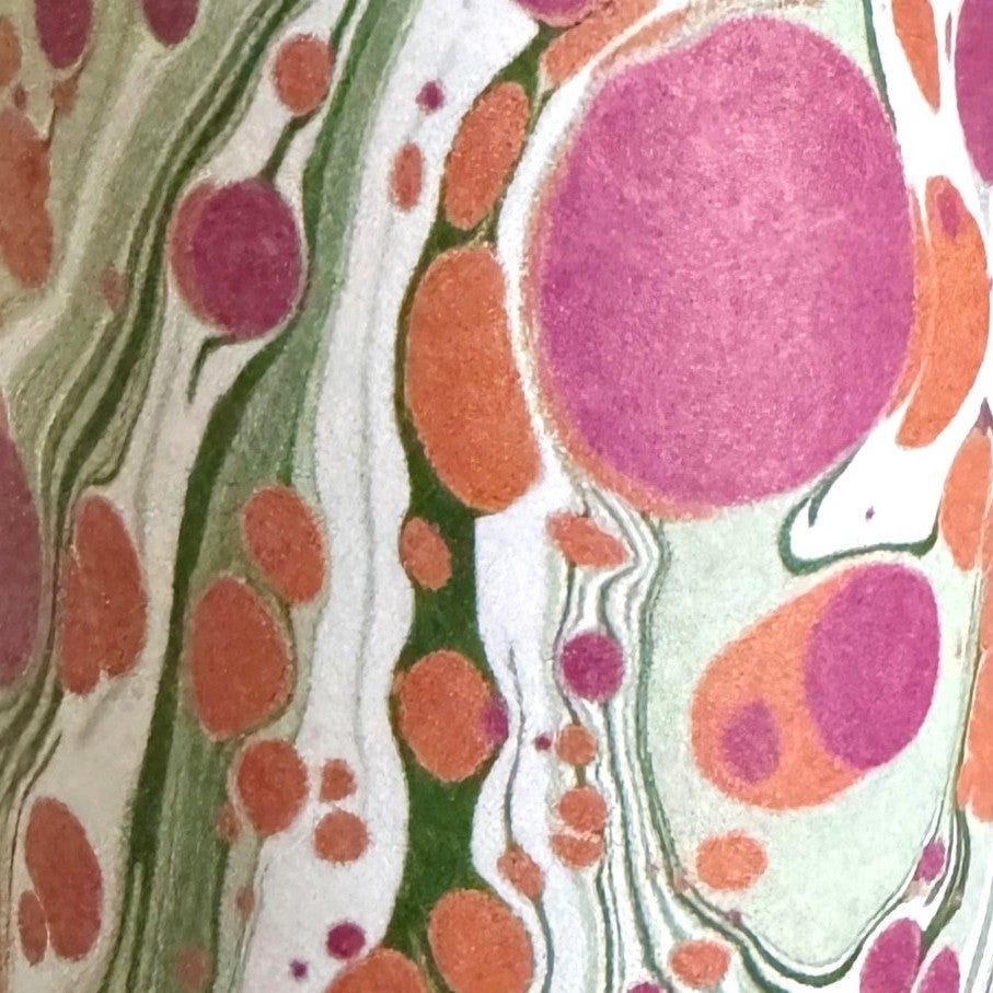 printed marbled design gift wrap with a marbled spot design in green, pink and orange.  By Compton Marbling