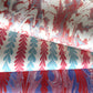 Three rolls of marbled paper with distinct patterns: a red, white, and blue leaf pattern; a red, white, and light blue pattern; and a red, white, and purple marbled pattern, all on a white background.