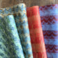 four sheets of wrapping paper with paste paper patterns