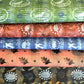 five sheets of patterned wrapping papers from Danby Press, with painterly designs of paste papers and relief prints.