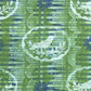 a sheet of wrapping paper from the Danby Press with a  backdrop of green paste paper design and circular stamped white bird motifs