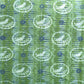 a sheet of wrapping paper from the Danby Press with a  backdrop of green paste paper design and circular stamped white bird motifs
